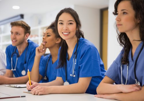 Nurses smiling during class Nurses smiling during class